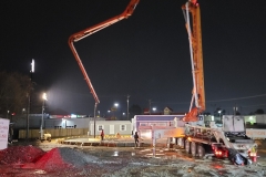 nighttime-construction-long-crane-lifting